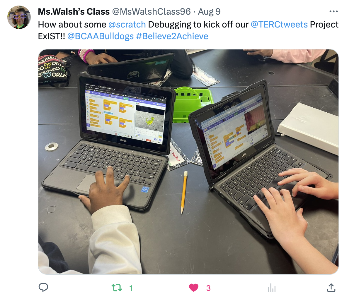 Two students on computers using TERC scratch curriculum.